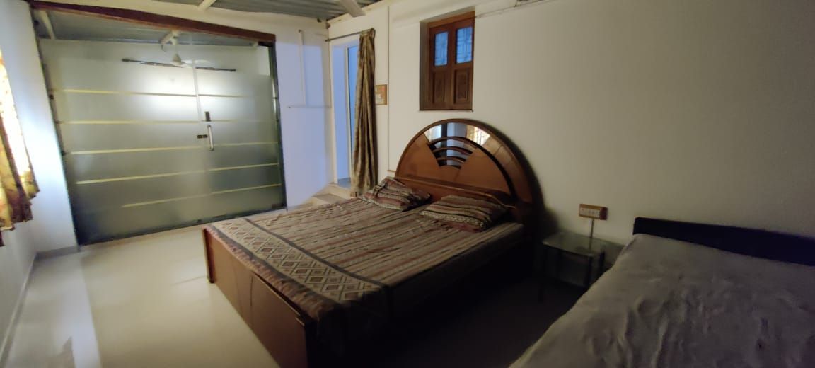 Bedroom with double and single bed