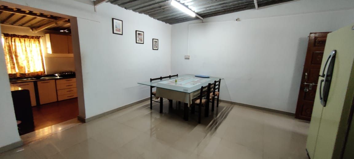 Dining room, kitchen beyond