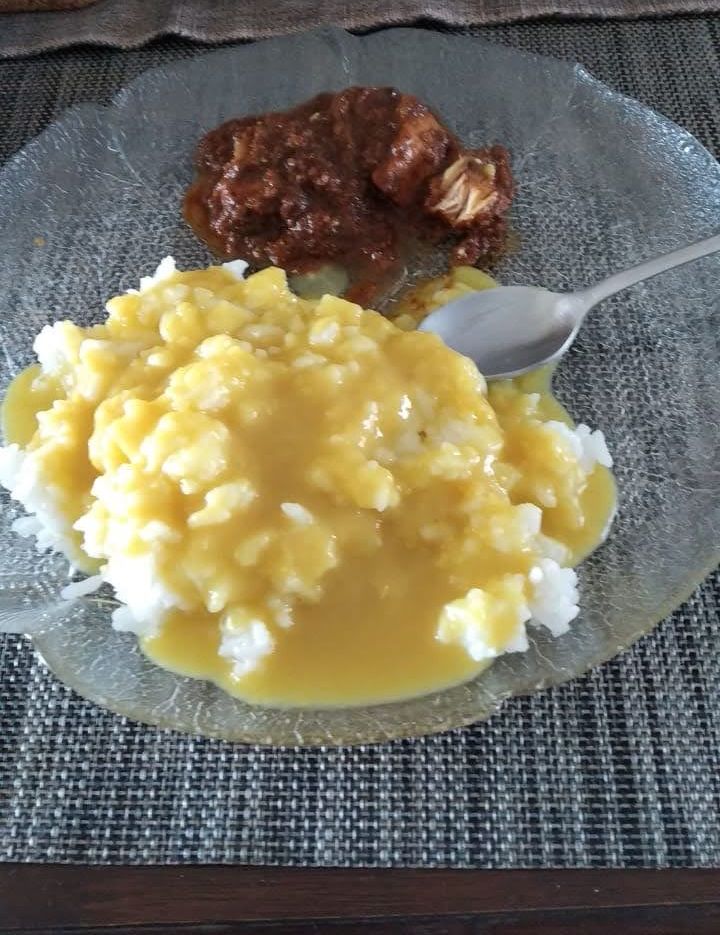 Dal and rice with a spoon of curry