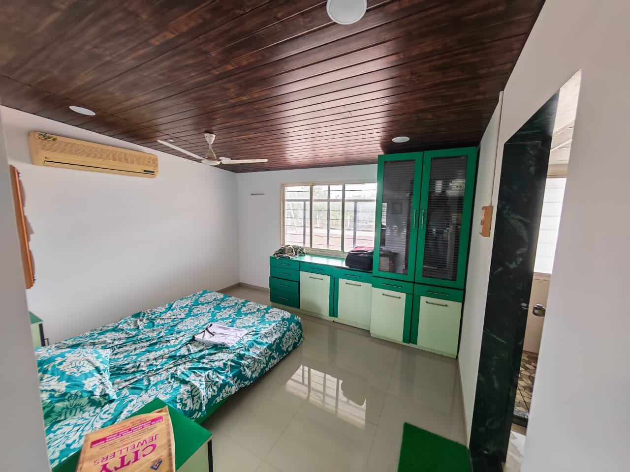 Bedroom green cabinets