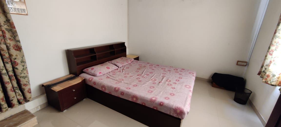 Bedroom with pink bedspread